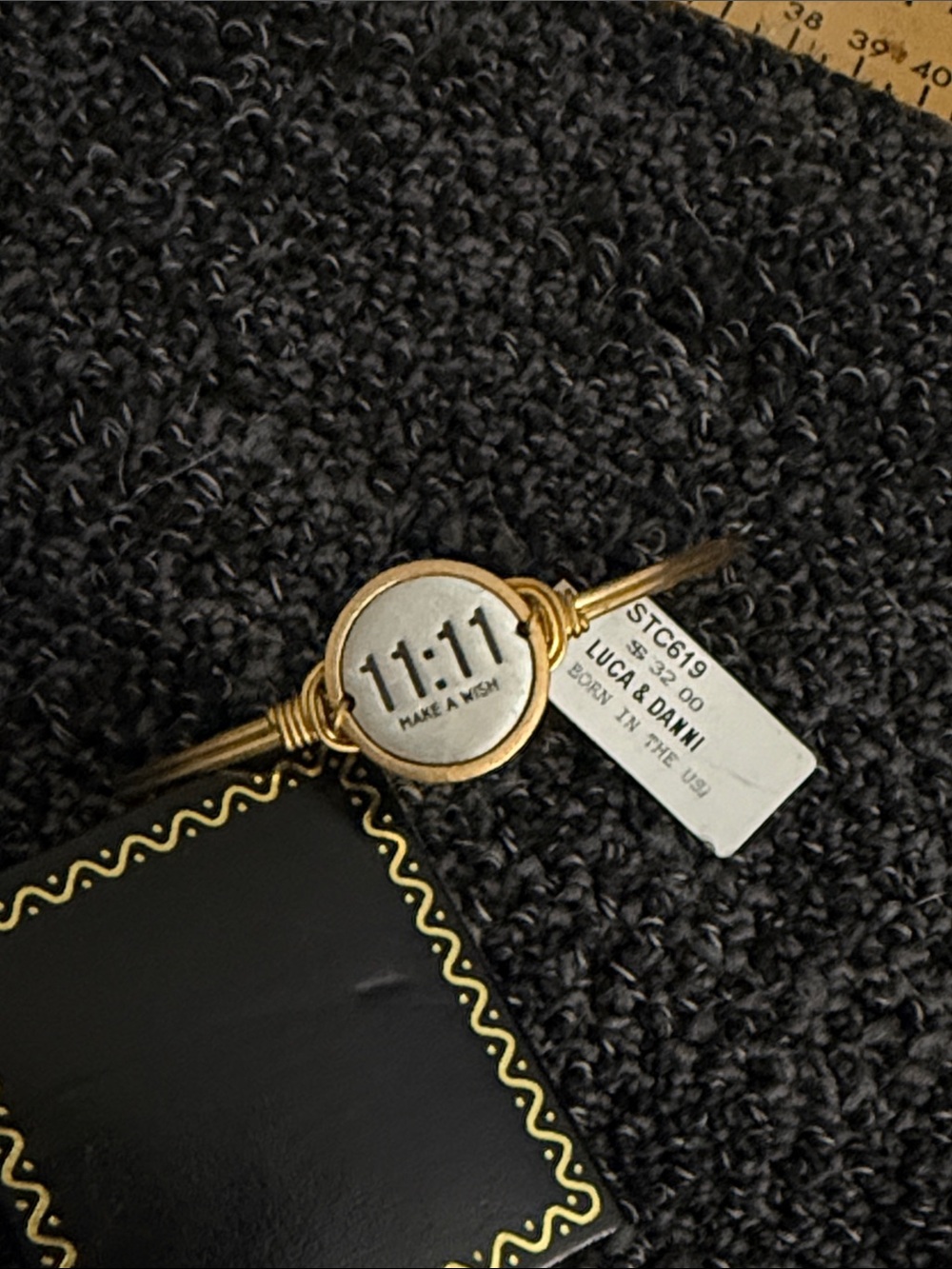 Accessory appears to be a wrist bracelet, not a bag
